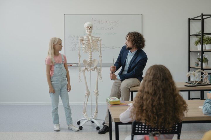 teacher teaching biology on a student